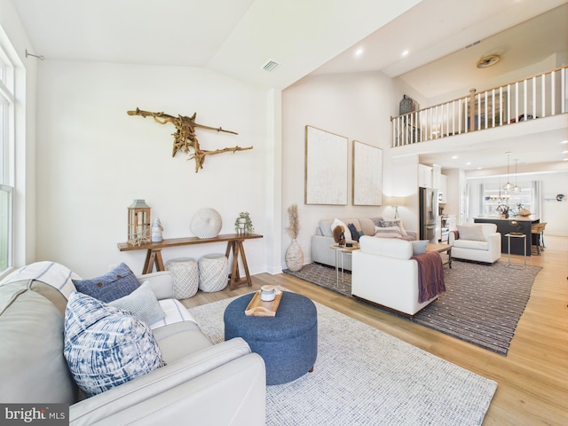 11020 Augusta Ln Unit 3, Berlin, MD 21811 - living area with wood finished floors, baseboards, and high vaulted ceiling