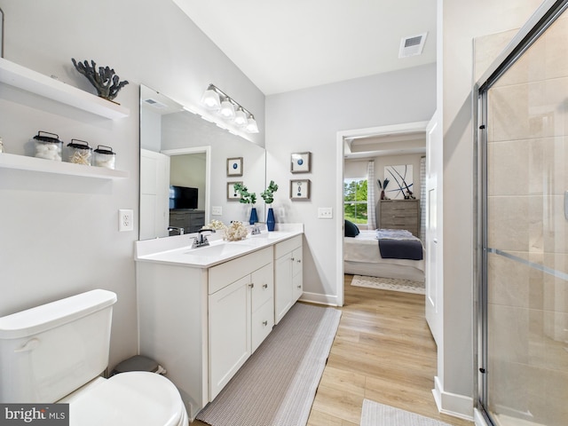 11020 Augusta Ln Unit 3, Berlin, MD 21811 - full bath with connected bathroom, wood finished floors, double vanity, toilet, and a stall shower