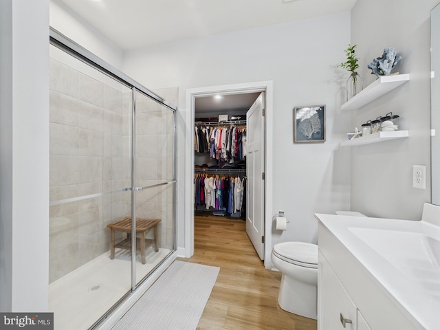 11020 Augusta Ln Unit 3, Berlin, MD 21811 - full bath featuring a stall shower, vanity, toilet, wood finished floors, and a walk in closet