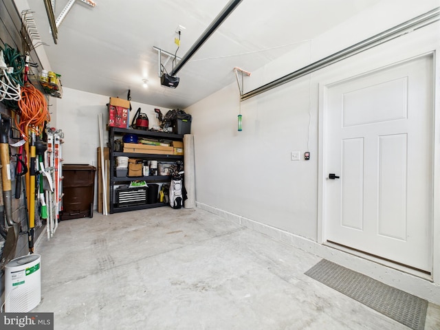 11020 Augusta Ln Unit 3, Berlin, MD 21811 - garage featuring a garage door opener