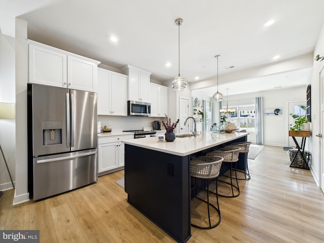 11020 Augusta Ln Unit 3, Berlin, MD 21811 - kitchen featuring stainless steel appliances, white cabinetry, a kitchen breakfast bar, light countertops, and recessed lighting