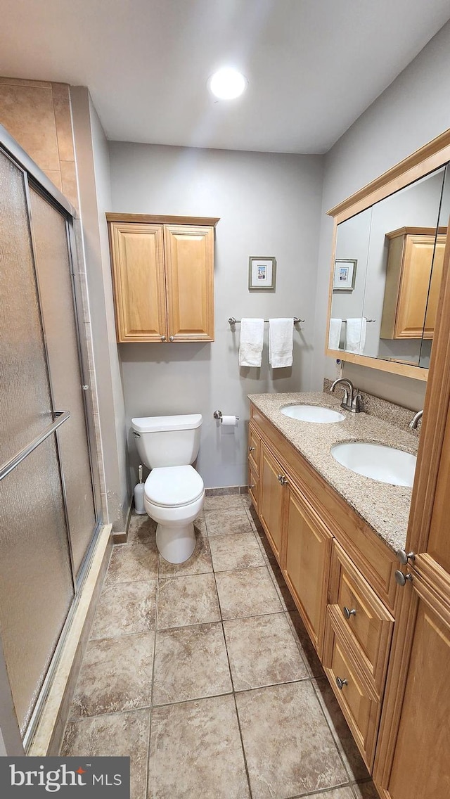 15204 Watergate Rd, Silver Spring, MD 20905 - full bathroom featuring a shower stall, double vanity, and toilet