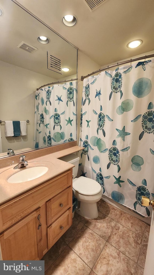15204 Watergate Rd, Silver Spring, MD 20905 - bathroom with vanity, toilet, tile patterned flooring, recessed lighting, and a shower with shower curtain