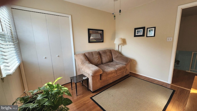 15204 Watergate Rd, Silver Spring, MD 20905 - living area featuring wood finished floors, healthy amount of natural light, and baseboards