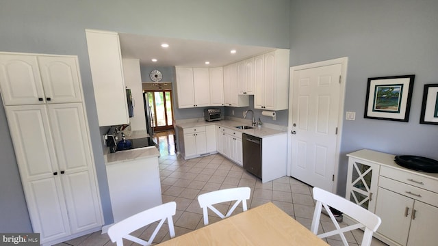 15204 Watergate Rd, Silver Spring, MD 20905 - kitchen featuring a sink, dishwasher, light tile patterned flooring, white cabinetry, and a towering ceiling