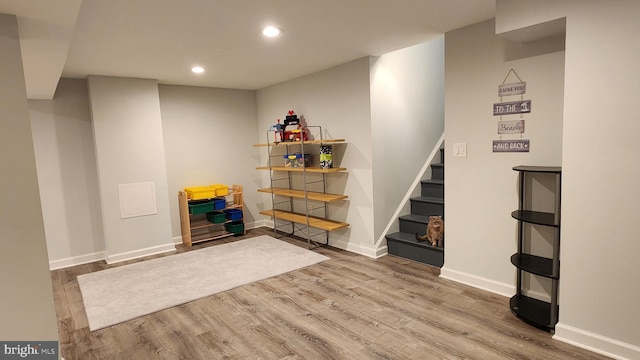 15204 Watergate Rd, Silver Spring, MD 20905 - finished below grade area featuring wood finished floors, recessed lighting, stairs, and baseboards