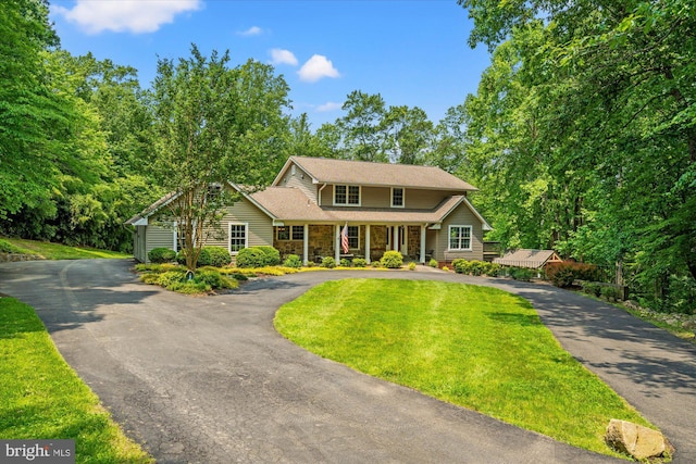 8112 Vista Point Ln, Fairfax Station, VA 22039 - traditional home with asphalt driveway, stone siding, a front lawn, and a porch
