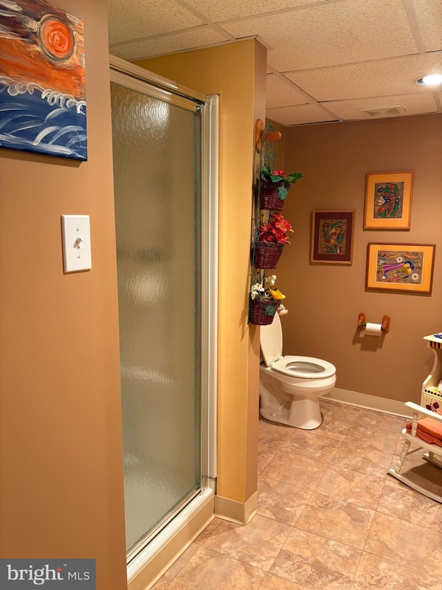3108 Centennial Unit 310, Warminster, PA 18974 - bathroom with a drop ceiling, a shower stall, toilet, baseboards, and tile patterned floors