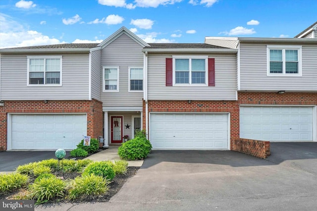 2325 Slater Hill Ln E Unit 39, York, PA 17406 - multi unit property with driveway, an attached garage, and brick siding