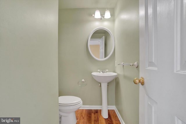 2325 Slater Hill Ln E Unit 39, York, PA 17406 - bathroom featuring wood finished floors, toilet, and baseboards