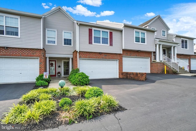 2325 Slater Hill Ln E Unit 39, York, PA 17406 - view of property featuring driveway, an attached garage, and brick siding