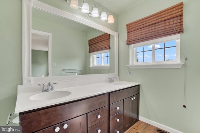 2325 Slater Hill Ln E Unit 39, York, PA 17406 - full bathroom with double vanity, wood finished floors, and baseboards