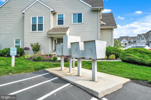 2325 Slater Hill Ln E Unit 39, York, PA 17406 - view of front facade with a shingled roof, uncovered parking, a front lawn, and a residential view