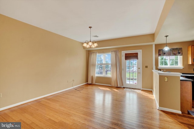 2325 Slater Hill Ln E Unit 39, York, PA 17406 - unfurnished dining area featuring light wood-type flooring, a chandelier, and baseboards