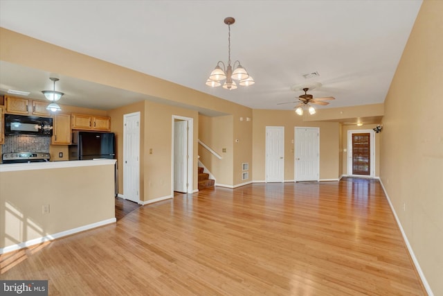 2325 Slater Hill Ln E Unit 39, York, PA 17406 - unfurnished living room with stairway, light wood-style floors, a ceiling fan, a chandelier, and baseboards