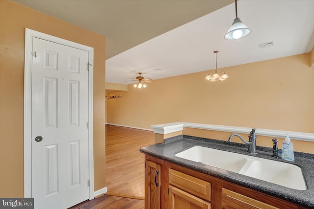 2325 Slater Hill Ln E Unit 39, York, PA 17406 - kitchen featuring a sink, dark countertops, wood finished floors, pendant lighting, and ceiling fan