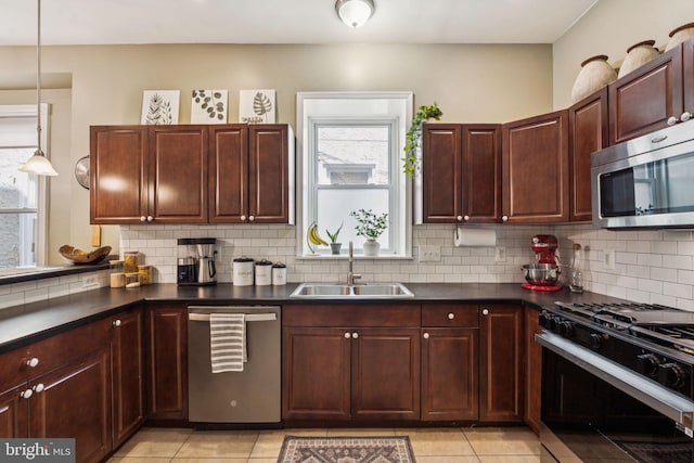 152 W Sharpnack St, Philadelphia, PA 19119 - kitchen featuring appliances with stainless steel finishes, a sink, dark countertops, and backsplash