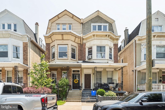 152 W Sharpnack St, Philadelphia, PA 19119 - view of property with brick siding, cooling unit, and covered porch