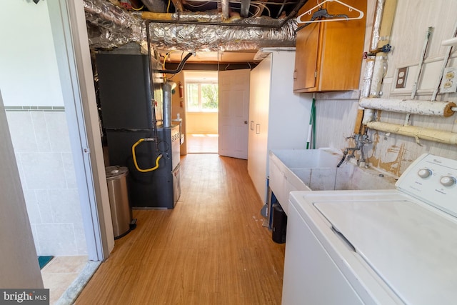 1545 Shoemaker Rd, Abington, PA 19001 - laundry area with washer / clothes dryer, light wood-style flooring, cabinet space, and heating unit
