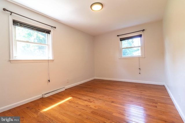 1545 Shoemaker Rd, Abington, PA 19001 - unfurnished room featuring a baseboard heating unit and light wood-type flooring