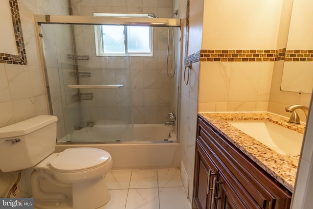 1545 Shoemaker Rd, Abington, PA 19001 - bathroom with tile walls, vanity, combined bath / shower with glass door, and marble finish flooring