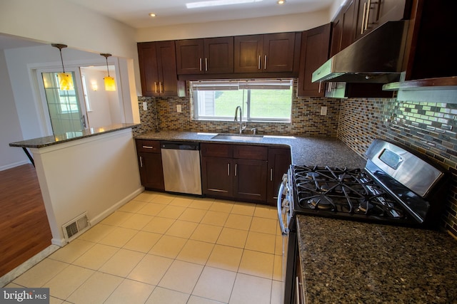 1545 Shoemaker Rd, Abington, PA 19001 - kitchen featuring stainless steel appliances, under cabinet range hood, a peninsula, backsplash, and dark stone countertops