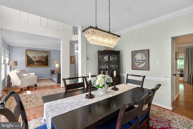 1412 Eagle Ridge Run, Bel Air, MD 21014 - dining room featuring crown molding, wood finished floors, a chandelier, and baseboards