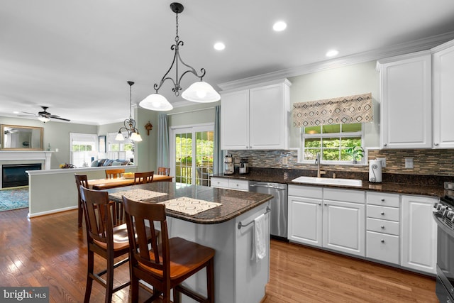 1412 Eagle Ridge Run, Bel Air, MD 21014 - kitchen with a sink, dishwasher, white cabinetry, backsplash, and ornamental molding