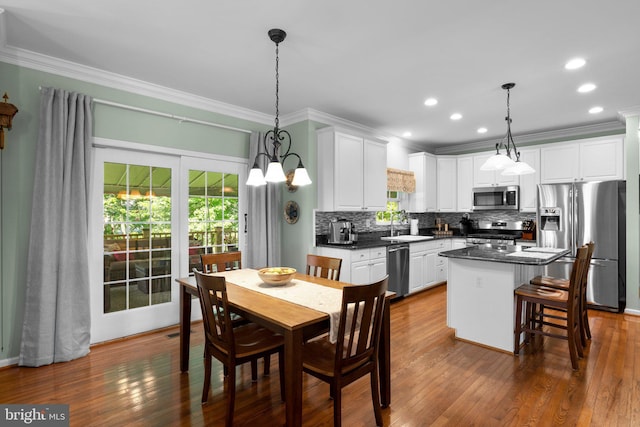1412 Eagle Ridge Run, Bel Air, MD 21014 - dining area with ornamental molding, dark wood-type flooring, recessed lighting, and a chandelier
