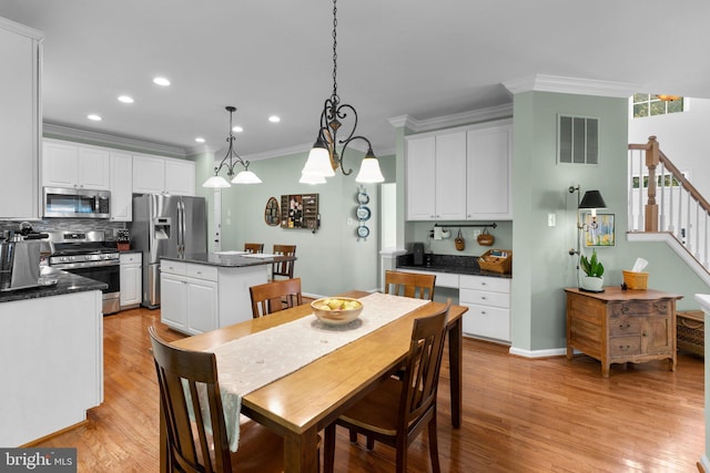 1412 Eagle Ridge Run, Bel Air, MD 21014 - dining area featuring crown molding, light wood-style floors, stairs, recessed lighting, and baseboards