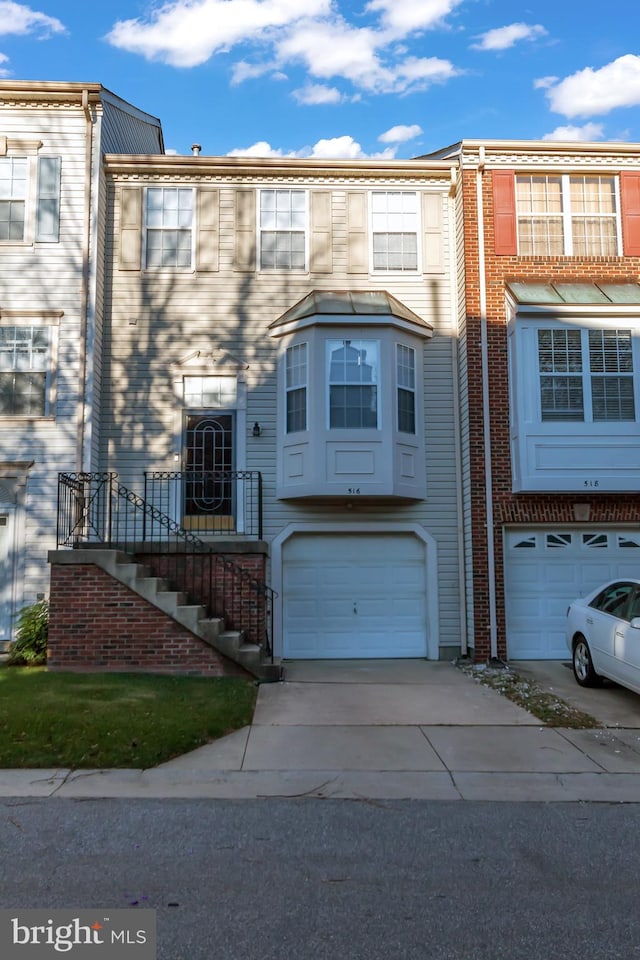 516 Crusher Ct, Upper Marlboro, MD 20774 - view of property featuring a garage and concrete driveway