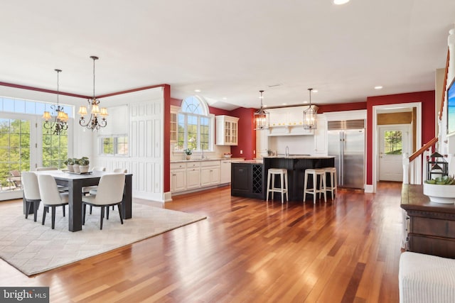 2 Autumn Meadow Ln, Malvern, PA 19355 - dining area featuring light wood-style flooring, recessed lighting, a chandelier, and healthy amount of natural light