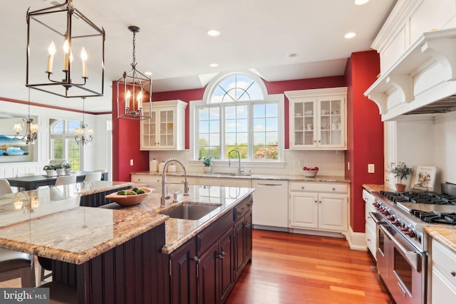 2 Autumn Meadow Ln, Malvern, PA 19355 - kitchen featuring range with two ovens, a sink, white dishwasher, a chandelier, and recessed lighting
