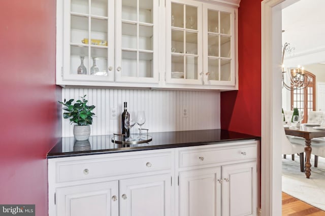 2 Autumn Meadow Ln, Malvern, PA 19355 - indoor dry bar featuring a chandelier and light wood-style flooring