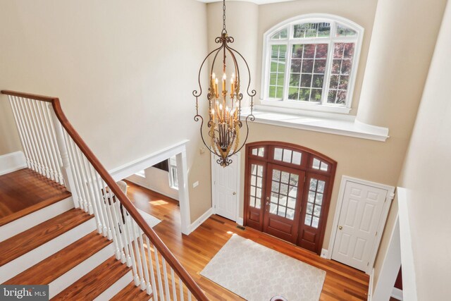 2 Autumn Meadow Ln, Malvern, PA 19355 - entryway with a chandelier, a towering ceiling, wood finished floors, stairway, and baseboards