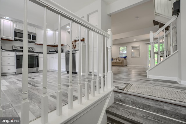 608 Budleigh Cir, Lutherville Timonium, MD 21093 - staircase with wood finished floors and recessed lighting