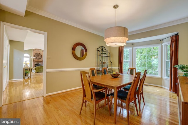 20479 Quarterpath Trace Cir, Sterling, VA 20165 - dining room featuring light wood finished floors, baseboards, plenty of natural light, and crown molding
