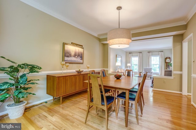 20479 Quarterpath Trace Cir, Sterling, VA 20165 - dining room with light wood-style floors, crown molding, and baseboards