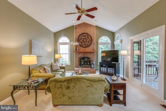20479 Quarterpath Trace Cir, Sterling, VA 20165 - carpeted living room featuring a ceiling fan, a fireplace, healthy amount of natural light, baseboards, and high vaulted ceiling