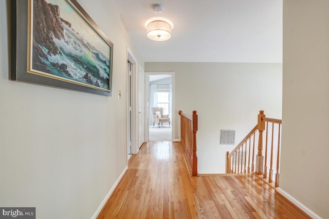 20479 Quarterpath Trace Cir, Sterling, VA 20165 - hall featuring an upstairs landing, light wood-style floors, and baseboards