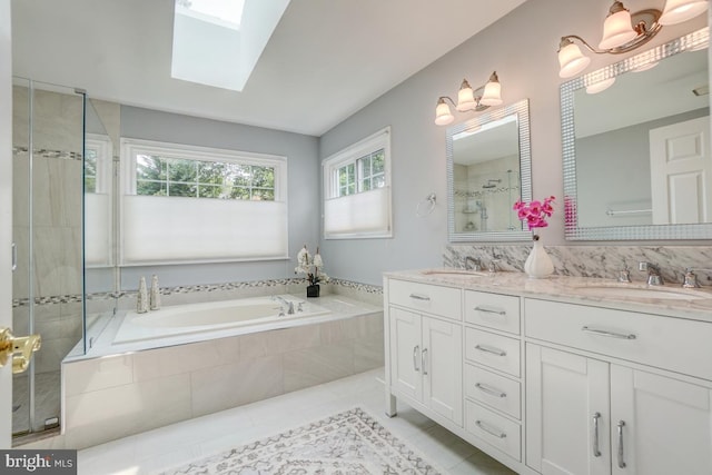 20479 Quarterpath Trace Cir, Sterling, VA 20165 - bathroom with double vanity, a garden tub, tile patterned flooring, a skylight, and a tile shower