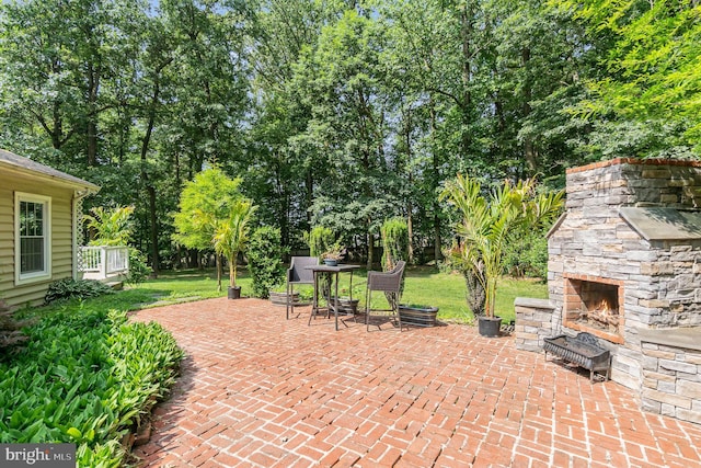 2414 Laurel Bush Rd, Abingdon, MD 21009 - view of patio featuring an outdoor stone fireplace and view of wooded area