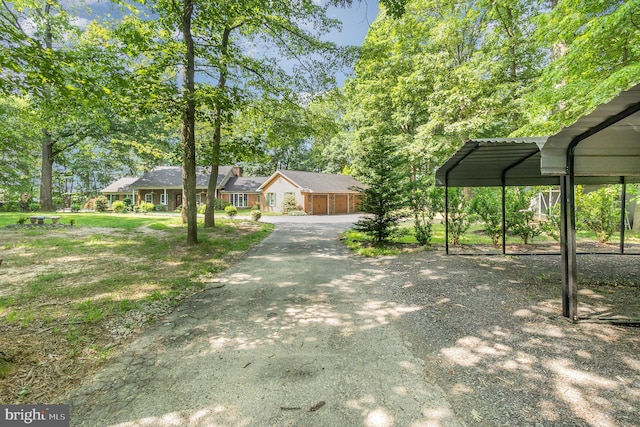 2414 Laurel Bush Rd, Abingdon, MD 21009 - view of yard featuring asphalt driveway and a garage