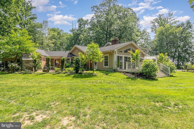 2414 Laurel Bush Rd, Abingdon, MD 21009 - back of property with a lawn, a deck, and a chimney