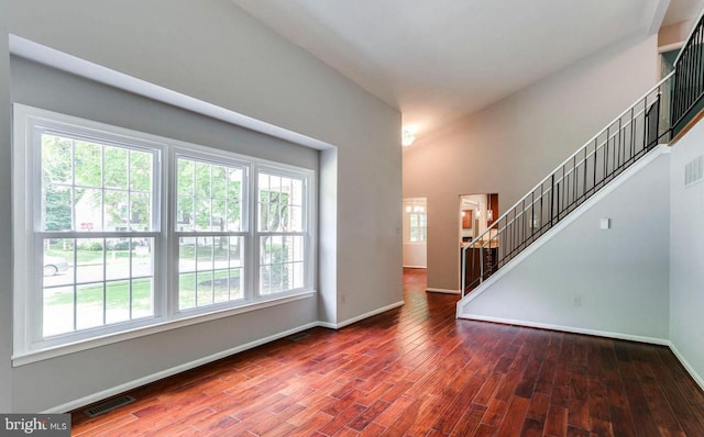 9456 Keepsake Way, Columbia, MD 21046 - unfurnished living room featuring wood finished floors and stairway