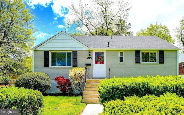 2816 Denley Pl, Silver Spring, MD 20906 - ranch-style home with brick siding, a front yard, and roof with shingles