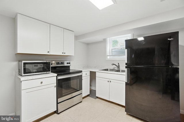 2816 Denley Pl, Silver Spring, MD 20906 - kitchen featuring stainless steel appliances, white cabinets, light countertops, and light floors