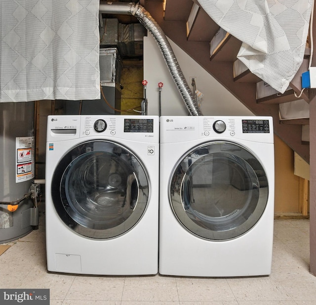2816 Denley Pl, Silver Spring, MD 20906 - laundry room with washer and clothes dryer and gas water heater