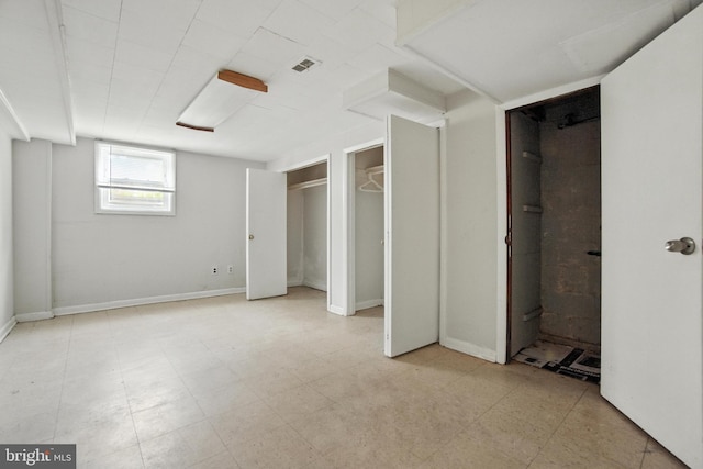 2816 Denley Pl, Silver Spring, MD 20906 - unfurnished bedroom featuring light flooring and two closets