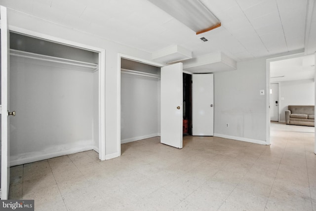 2816 Denley Pl, Silver Spring, MD 20906 - unfurnished bedroom featuring multiple closets and tile patterned floors